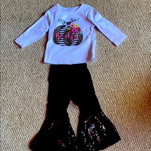 Sequin bell bottom outfit.